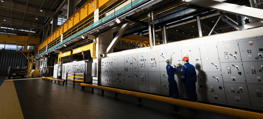 Workers in a big factory room